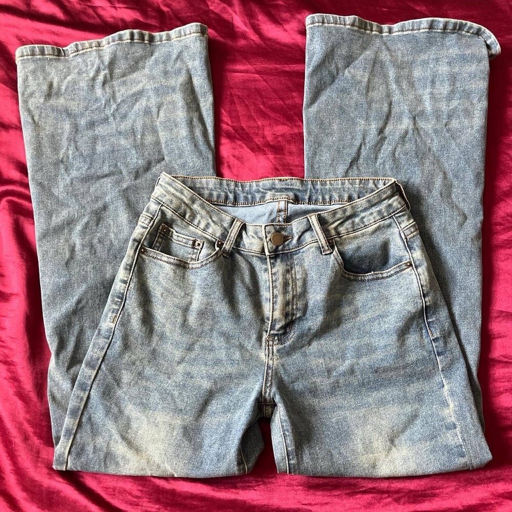 Blue washed flared jeans.